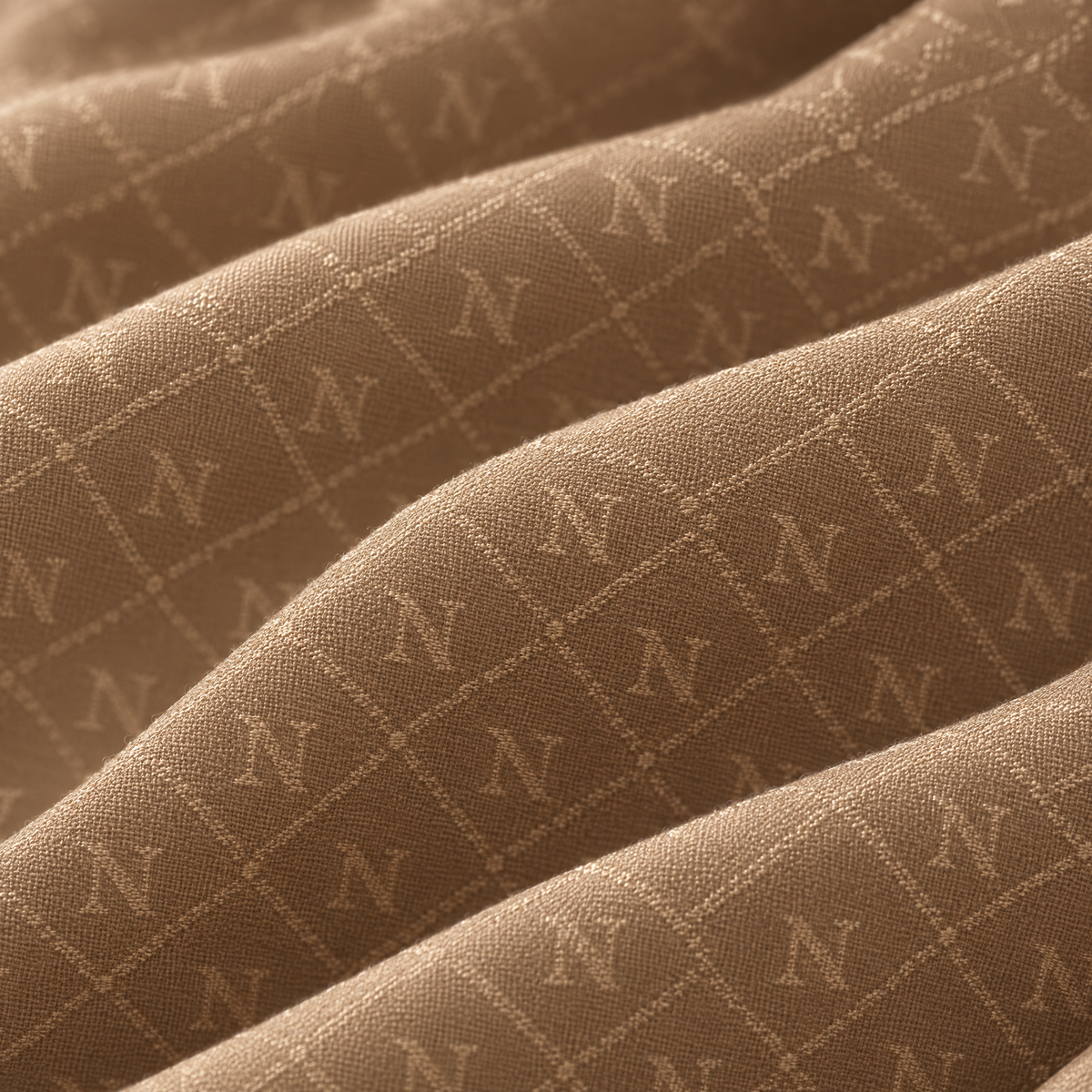 Detail tenun jacquard monogram N Nuréa Monogram Series, warna Beige